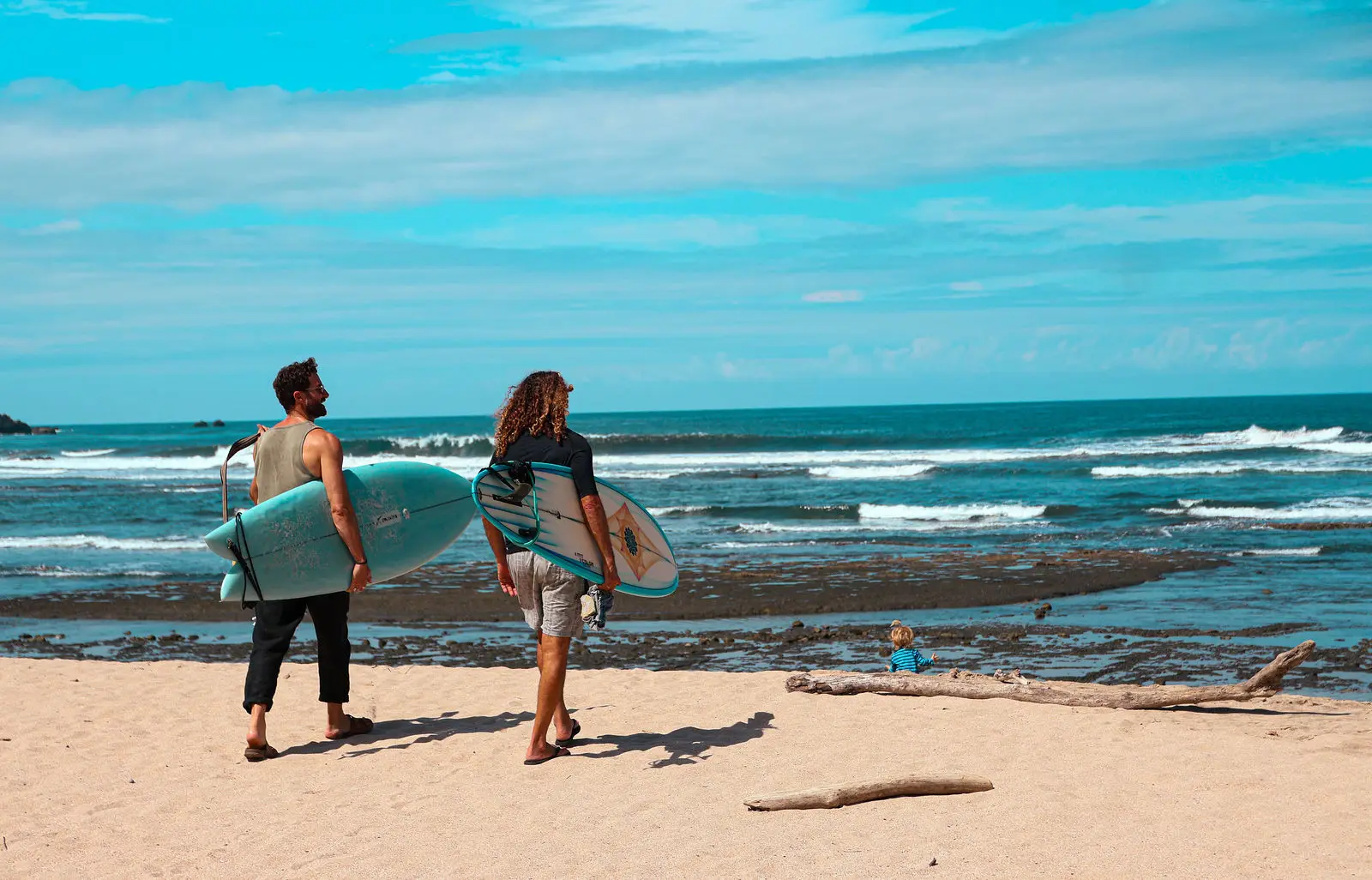 Surfers walking the beach near Naya Nosara